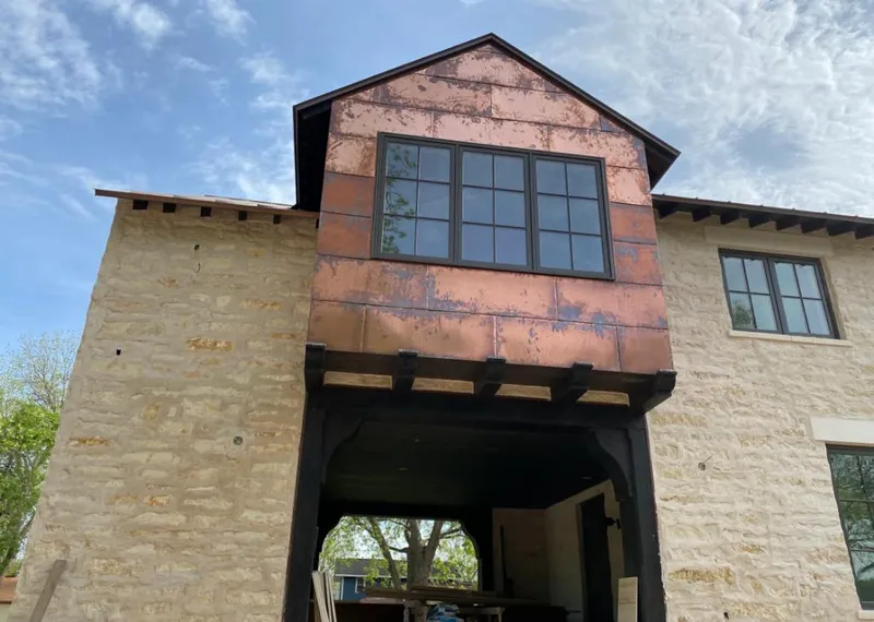 Copper metal panel facade on a stone building for Skylight Installation in Lansdale